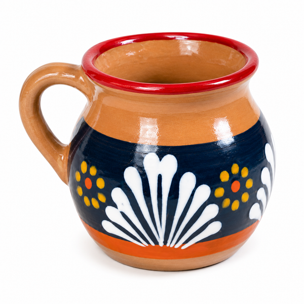 A hand-painted ceramic mug with a terracotta handle and base, featuring a navy blue band decorated with white scallop motifs and yellow dots, and a red rim.