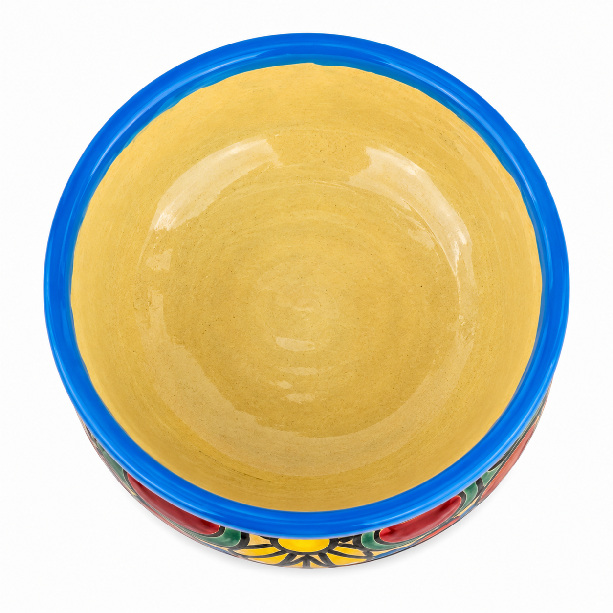 A hand-painted ceramic bowl with a glossy yellow interior, a bright blue rim, and a colorful hand-painted floral pattern at the base, shown from a top-down view on a white background.